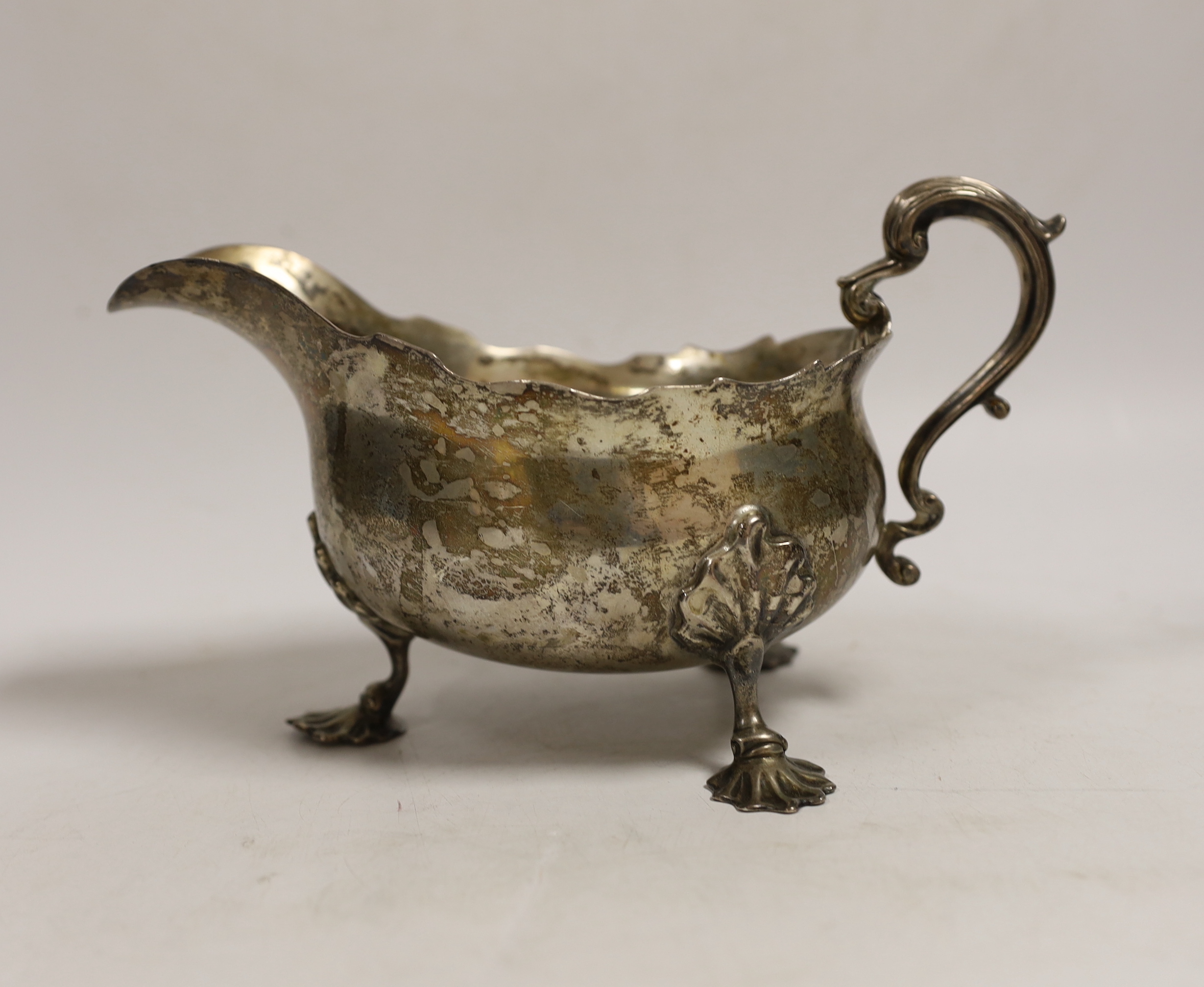 A large late Victorian silver sauceboat, Carrington & Co?, London, 1897, length 21.2cm, 15.9oz.